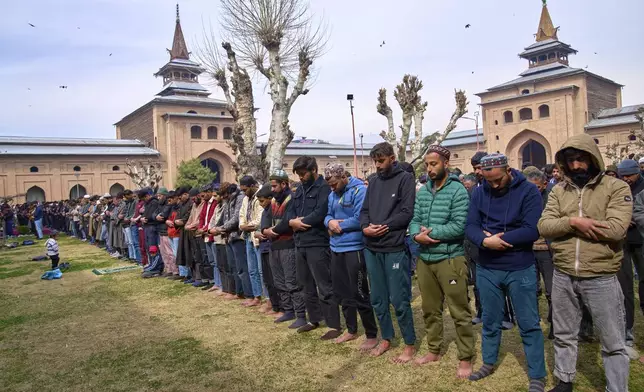 Kashmiri Muslims offer prayers during the first Friday of the fasting month of Ramadan outside the Jamia Masjid or Grand Mosque in Srinagar, Indian controlled Kashmir, Friday, March 7, 2025. (AP Photo/Dar Yasin)