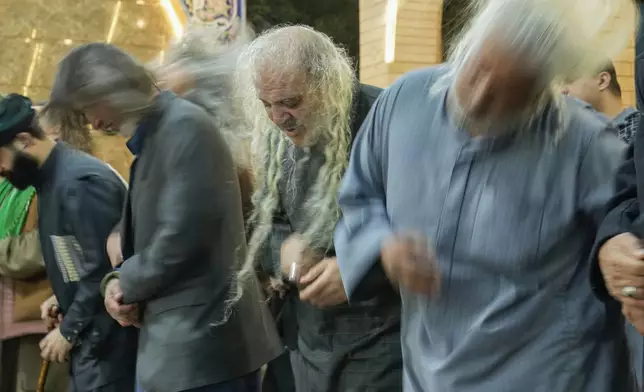 Dervishes ululate at the sound of drums during a Sufi Muslim ceremony of al-Talia al-Kestezania to commemorate in the month of Ramadan in Baghdad, Iraq, Thursday, March 6, 2025. (AP Photo/Hadi Mizban)
