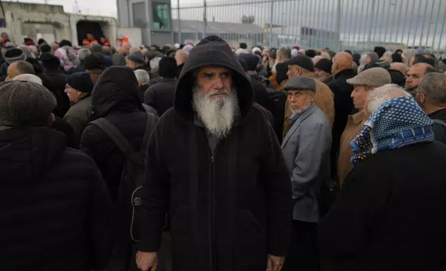 Palestinian Shareef Baleya, 65, leaves after he was not allowed to cross from the Israeli military Qalandia checkpoint near the West Bank city of Ramallah to Jerusalem, to participate in the Friday prayers at the Al-Aqsa Mosque compound during the Muslim holy month of Ramadan, Friday, March 21, 2025. (AP Photo/Nasser Nasser)