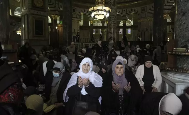 Women pray at the Al-Aqsa Mosque compound during the first Friday Prayers of the Muslim holy month of Ramadan in the Old City of Jerusalem, Friday, March 7, 2025. (AP Photo/Mahmoud Illean)