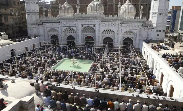 Muslims attend first Friday prayers during the Muslim holy fasting month of Ramadan, at the historic Mahabat Khan Mosque, in Peshawar, Pakistan, Friday, March 7, 2025. (AP Photo/Muhammad Sajjad)