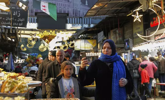 Syrians look for sweets to buy during Ramadan, the holy month for Muslims, in Damascus, Syria, Saturday, March 1, 2025.(AP Photo/Omar Sanadiki)