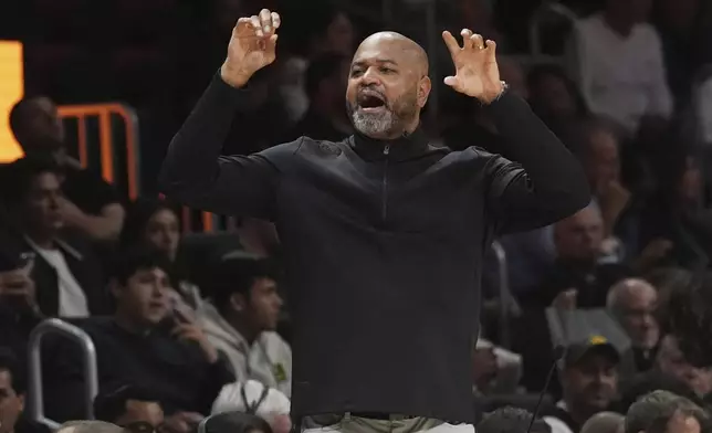 Detroit Pistons head coach J.B. Bickerstaff gestures during the first half of an NBA basketball game against the Miami Heat, Wednesday, March 19, 2025, in Miami. (AP Photo/Marta Lavandier)