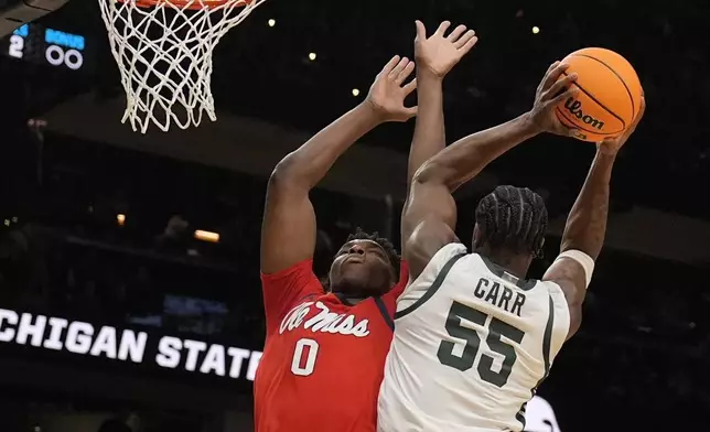 Michigan State forward Coen Carr (55) shoots against Mississippi forward Malik Dia (0) during the first half in the Sweet 16 of the NCAA college basketball tournament, Friday, March 28, 2025, in Atlanta. (AP Photo/Brynn Anderson)