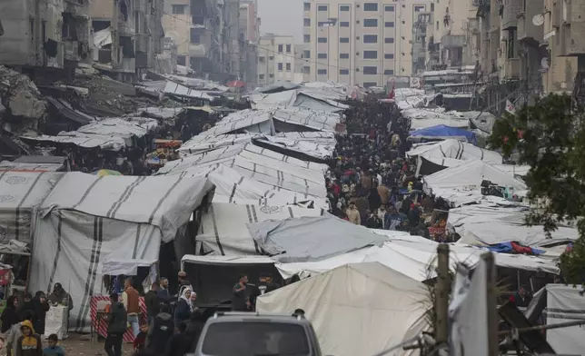 Palestinians shop at Sheikh Radwan Market, west of Gaza City, before the Iftar, the fast-breaking meal, during the holy month of Ramadan on Monday, March 3, 2025. (AP Photo/Jehad Alshrafi)