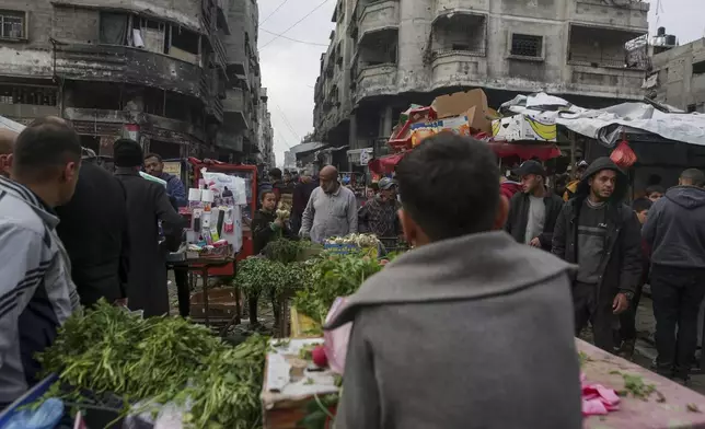 Palestinians shop at Sheikh Radwan Market, west of Gaza City, before the Iftar, the fast-breaking meal, during the holy month of Ramadan on Monday, March 3, 2025. (AP Photo/Jehad Alshrafi)