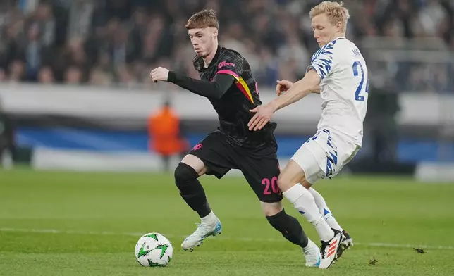 Chelsea's Cole Palmer, left, and Copenhagen's Birger Meling in action during the Conference League round of 16 soccer match between FC Copenhagen and Chelsea FC at Parken Stadium in Copenhagen, Denmark, Thursday March 6, 2025. (Liselotte Sabroe/Ritzau Scanpix via AP)