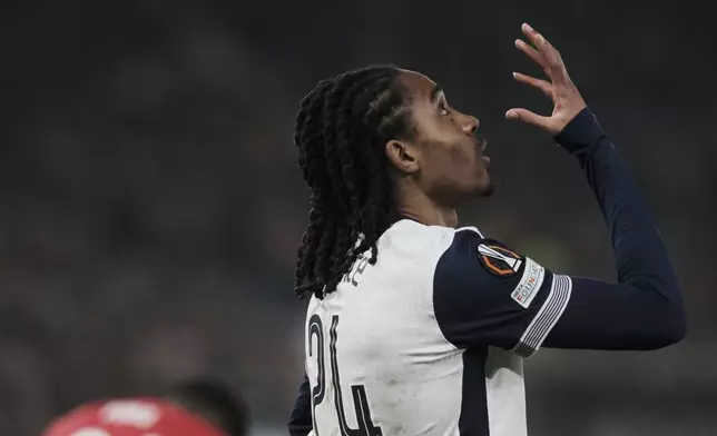 Tottenham's Djed Spence gestures during the Europa League round of 16 first leg match between AZ and Tottenham at AFAS Stadium, in Alkmaar, in Alkmaar, Netherlands , Thursday, March 6, 2025. (AP Photo/Patrick Post)