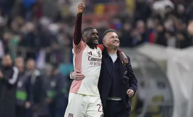 Lyon's Clinton Mata salutes fans at the end of the Europa League round of 16, first leg soccer match between FCSB and Lyon at the National Arena stadium, Thursday, March 6, 2025. (AP Photo/Andreea Alexandru)