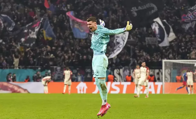 FCSB's goalkeeper Stefan Tarnovanu celebrates his team's first goal, scored by Alexandru Baluta, during the Europa League round of 16, first leg soccer match between FCSB and Lyon at the National Arena stadium, Thursday, March 6, 2025. (AP Photo/Andreea Alexandru)