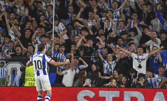 Real Sociedad's Mikel Oyarzabal celebrates after scoring his side's opening goal during the Europa League round of 16 first leg soccer match between Real Sociedad and Manchester United at the Reale Arena in San Sebastian, Spain, Thursday, March 6, 2025. (AP Photo/Miguel Oses)