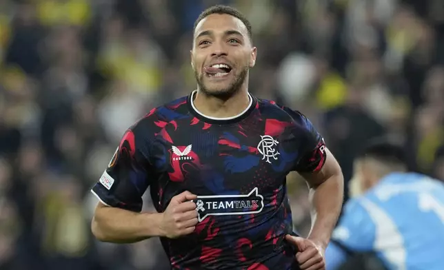 Rangers' Cyriel Dessers celebrates after scoring his side's second goal, which was disallowed during the Europa League round of 16 first leg soccer match between Fenerbahce and Rangers at Sukru Saracoglu stadium in Istanbul, Turkey, Thursday, March 6, 2025. (AP Photo/Khalil Hamra)