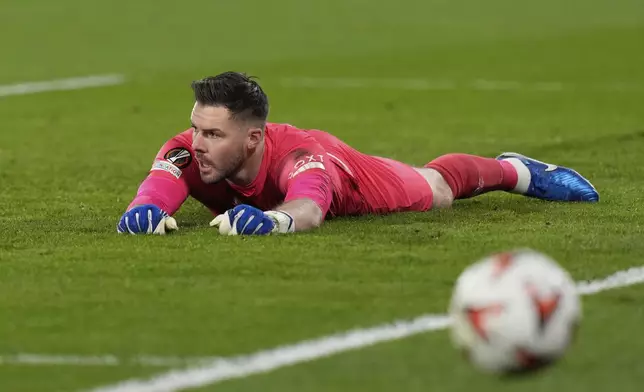 Rangers' goalkeeper Jack Butland makes a save during the Europa League round of 16 first leg soccer match between Fenerbahce and Rangers at Sukru Saracoglu stadium in Istanbul, Turkey, Thursday, March 6, 2025. (AP Photo/Khalil Hamra)