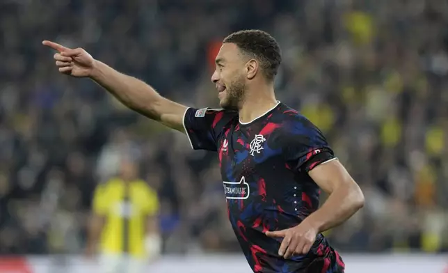 Rangers' Cyriel Dessers celebrates after scoring a goal, which was disallowed during the Europa League round of 16 first leg soccer match between Fenerbahce and Rangers at Sukru Saracoglu stadium in Istanbul, Turkey, Thursday, March 6, 2025. (AP Photo/Khalil Hamra)