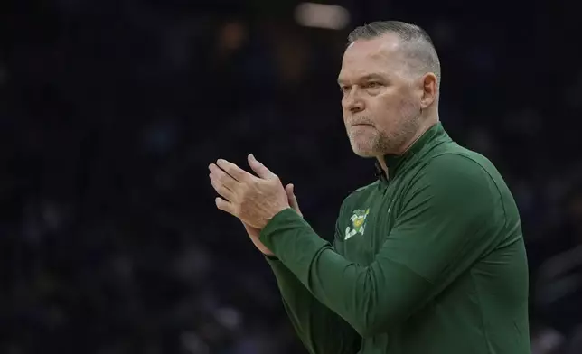 Denver Nuggets head coach Michael Malone reacts during the first half of an NBA basketball game against the Golden State Warriors, Monday, March 17, 2025, in San Francisco. (AP Photo/Godofredo A. Vásquez)
