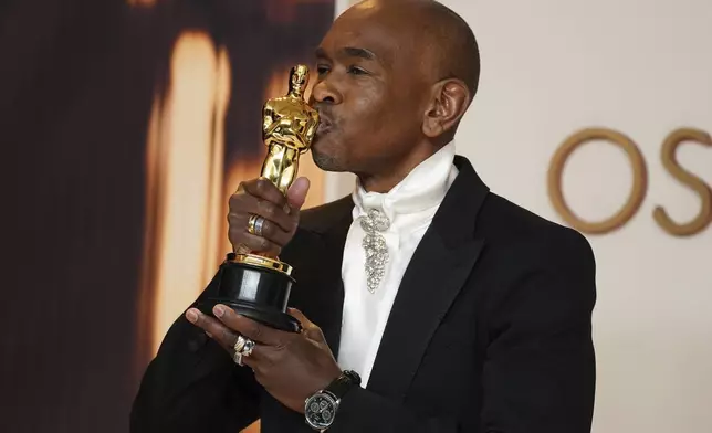 Paul Tazewell, winner of the award for best costume design for "Wicked," poses in the press room at the Oscars on Sunday, March 2, 2025, at the Dolby Theatre in Los Angeles. (Photo by Jordan Strauss/Invision/AP)