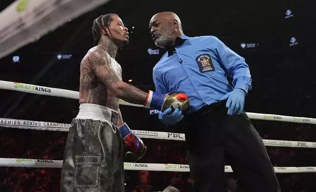 Gervonta Davis talks to the referee during the fourth round of a WBA lightweight championship boxing bout against Lamont Roach Sunday, March 2, 2025, in New York. (AP Photo/Frank Franklin II)