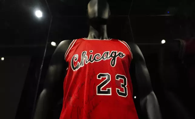 Michael Jordan's first game-worn Chicago Bulls jersey is displayed at Sotheby's, Friday, March 21, 2025, in New York, where they are set to be auctioned. (AP Photo/Julia Demaree Nikhinson)