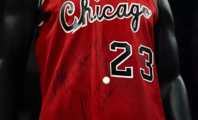 Michael Jordan's first game-worn Chicago Bulls jersey is displayed at Sotheby's, Friday, March 21, 2025, in New York, where they are set to be auctioned. (AP Photo/Julia Demaree Nikhinson)