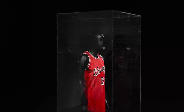 Michael Jordan's first game-worn Chicago Bulls jersey is displayed at Sotheby's, Friday, March 21, 2025, in New York, where they are set to be auctioned. (AP Photo/Julia Demaree Nikhinson)