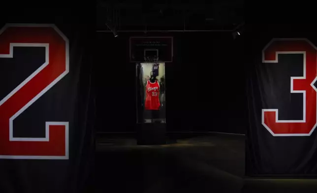 Michael Jordan's first game-worn Chicago Bulls jersey is displayed at Sotheby's, Friday, March 21, 2025, in New York, where they are set to be auctioned. (AP Photo/Julia Demaree Nikhinson)