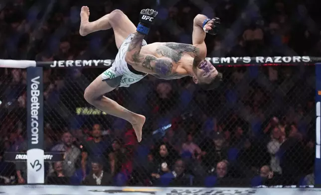 Mauricio Ruffy celebrates after defeating King Green during a UFC 313 mixed martial arts lightweight bout Saturday, March 8, 2025, in Las Vegas. (AP Photo/John Locher)