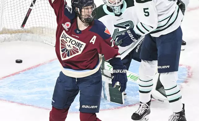 Montreal Victoire's Laura Stacey (7) reacts to a goal by teammate Kati Tabin against Boston Fleet goaltender Aerin Frankel (31) during the first period of a PWHL hockey game in Montreal, Saturday, March 1, 2025. (Graham Hughes/The Canadian Press via AP)