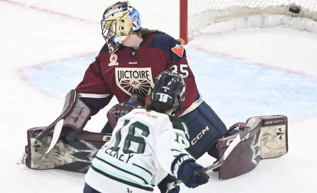 Boston Fleet's Amanda Pelkey (16) scores against Montreal Victoire goaltender Ann-Renee Desbiens during the first period of a PWHL hockey game in Montreal, Saturday, March 1, 2025. (Graham Hughes/The Canadian Press via AP)