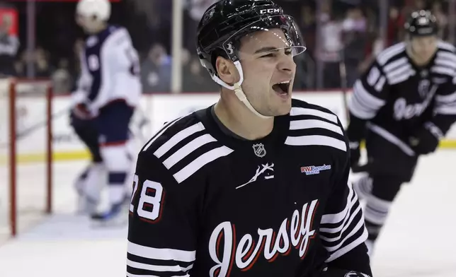 New Jersey Devils right wing Timo Meier reacts after scoring a goal during the second period of an NHL hockey game against the Columbus Blue Jackets, Tuesday, March 11, 2025, in Newark, N.J. (AP Photo/Adam Hunger)