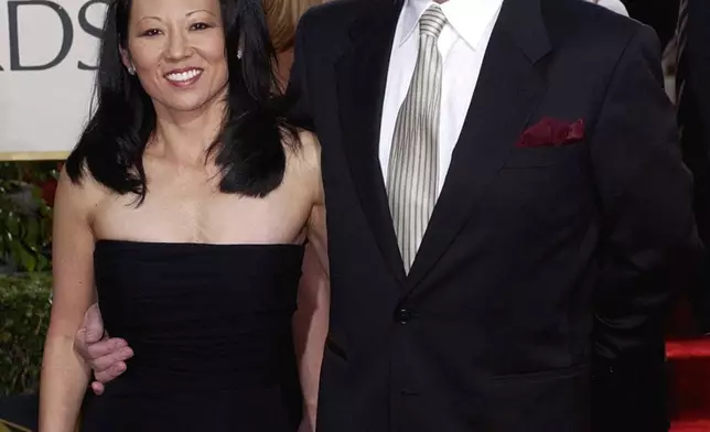 FILE - Actor Gene Hackman arrives with his wife, Betsy Arakawa, for the 60th Annual Golden Globe Awards in Beverly Hills, Calif., Sunday, Jan. 19, 2003. (AP Photo/Mark J. Terrill, File)