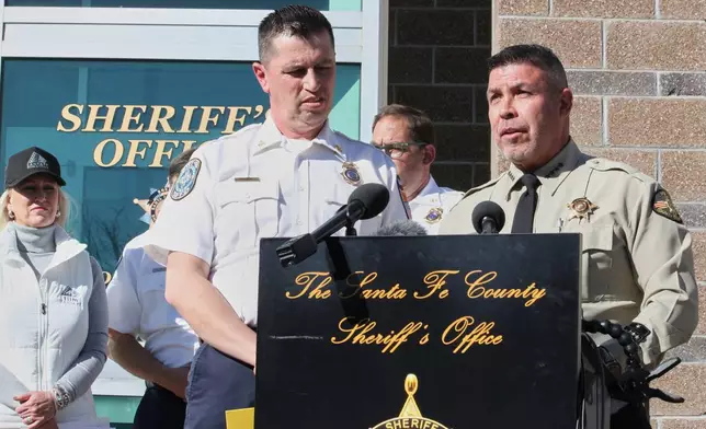 Santa Fe County Sheriff Adan Mendoza, right, and Santa Fe Fire Chief Brian Moya answer questions about the investigation into the deaths of actor Gene Hackman and his wife Betsy Arakawa during a news conference in Santa Fe, N.M., Friday, Feb. 28, 2025. (AP Photo/Susan Montoya Bryan)