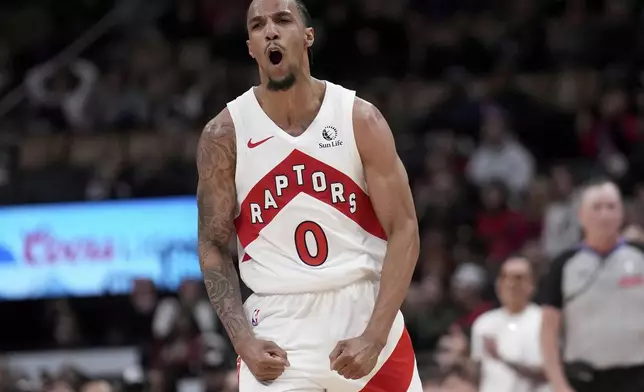Toronto Raptors guard A.J. Lawson (0) celebrates after his career high after sinking a 3-point basket during second-half NBA basketball game action against the Washington Wizards in Toronto, Monday, March 10, 2025. (Nathan Denette/The Canadian Press via AP)