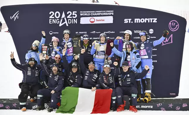 Team Italy with silver medalists Jasmin Coratti and Gabriel Messner and gold medalists Maurizio Bormolini and Elisa Caffont pose on the podium at the Snowboard Alpine Parallel-Slalom competition at the FIS Snowboard, Freestyle and Freeski World Championships, Sunday, March 23, 2025, in St. Moritz, Switzerland. (Gian Ehrenzeller/Keystone via AP)