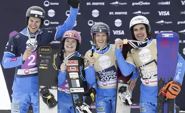 Silver medalists Gabriel Messner and Jasmin Coratti and gold medalists Elisa Caffont and Maurizio Bormolini of Italy, from left, pose at the Snowboard Alpine Parallel-Slalom competition at the FIS Snowboard, Freestyle and Freeski World Championships, Sunday, March 23, 2025, in St. Moritz, Switzerland. (Gian Ehrenzeller/Keystone via AP)