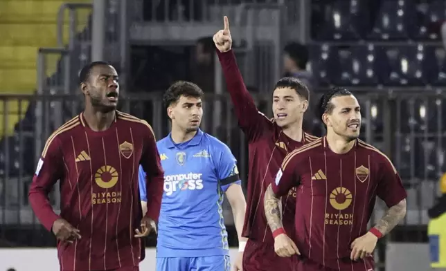 Roma's Matias Soule, center right, celebrates scoring during the Serie A soccer match between Empoli and Roma at the "Carlo Castellani - Computer Gross Arena" Stadium in Empoli, Italy, Sunday March 9, 2025. (Marco Bucco/LaPresse via AP)