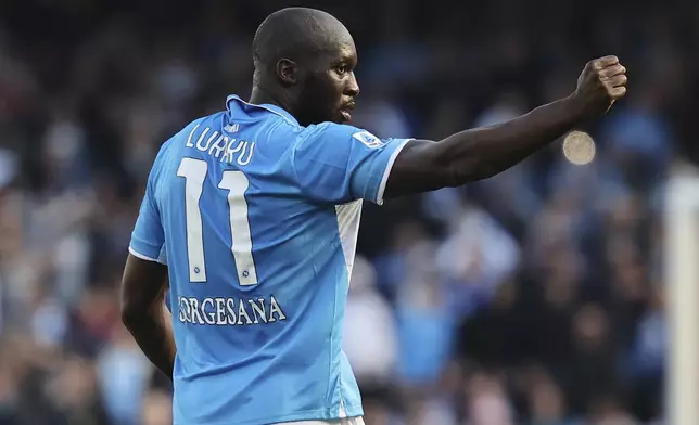 Napoli's Romelu Lukaku, right, celebrates scoring during the Serie A soccer match between Napoli and Fiorentina at the Diego Armando Maradona Stadium in Naples, Italy, Sunday March 9, 2025. (Alessandro Garofalo/LaPresse via AP)