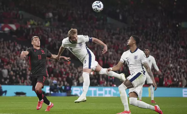 England's Harry Kane heads the ball during a World Cup qualifying soccer match between England and Albania at Wembley stadium in London, Friday, March 21, 2025. (AP Photo/Alastair Grant)