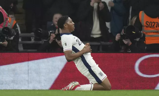 England's Myles Lewis-Kelly celebrates after scoring his side's opening goal during a World Cup qualifying soccer match between England and Albania at Wembley stadium in London, Friday, March 21, 2025. (AP Photo/Alastair Grant)
