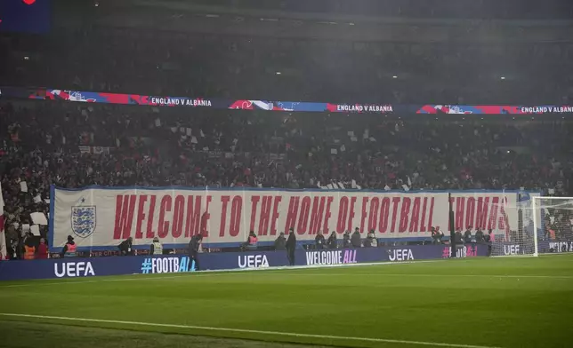 Spectators display a welcome banner for England coach Thomas Tuchel during a World Cup qualifying soccer match between England and Albania at Wembley stadium in London, Friday, March 21, 2025. (AP Photo/Alastair Grant)