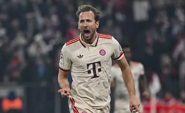 Munich's Harry Kane celebrates after scoring the opening goal during the Champions League round of 16 first leg soccer match between FC Bayern Munich and Bayer 04 Leverkusen in Munich, Germany, Wednesday, March 5, 2025. (Peter Kneffel/dpa via AP)