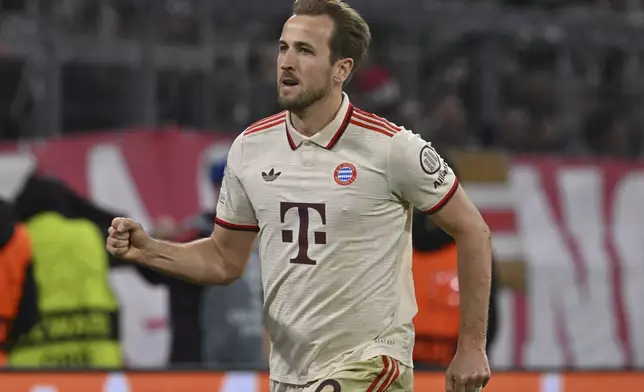 Munich's Harry Kane celebrates after scoring his side's third goal during the Champions League round of 16 first leg soccer match between FC Bayern Munich and Bayer 04 Leverkusen in Munich, Germany, Wednesday, March 5, 2025. (Peter Kneffel/dpa via AP)