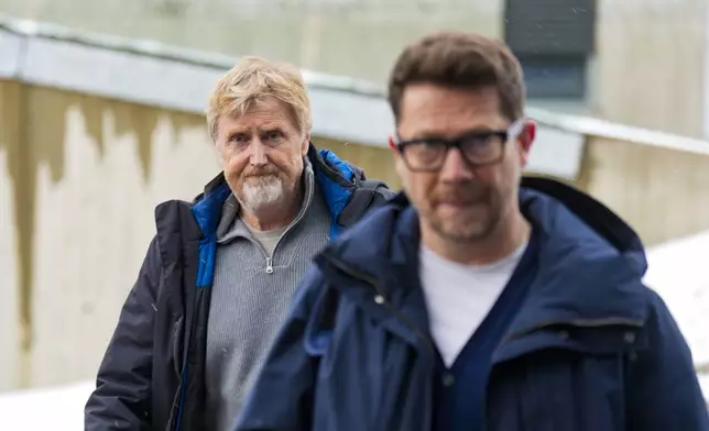 Ski jump manager of the Norwegian Ski Federation Jan-Erik Aalbu, left, and Head of communications of the Norwegian Ski Federation Espen Graff arrive for a news conference after the ski jump scandal, in Holmenkollen, Oslo, Norway, Tuesday March 12, 2025. (Heiko Junge/NTB Scanpix via AP)