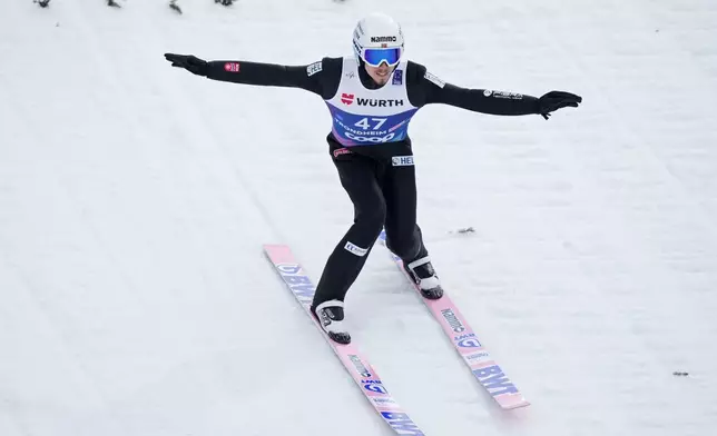 Johann Andre Forfang, of Norway, lands his first round jump of the ski jumping men's large hill individual competition at the Nordic World Ski Championships in Trondheim, Norway, Saturday, March 8, 2025. (AP Photo/Matthias Schrader)