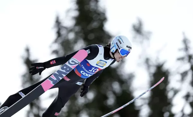 Johann Andre Forfang, of Norway, soars through the air during his first round jump of the ski jumping men's team large hill competition at the Nordic World Ski Championships in Trondheim, Norway, Thursday, March 6, 2025. (AP Photo/Matthias Schrader)