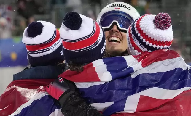 Anna Odine Stroem, Eirin Maria Kvandal, Marius Lindvik and Johann Andre Forfang of Norway celebrate after winning the Ski Jumping Mixed Team event at the Nordic World Championships in Trondheim, Norway, Wednesday, March 5, 2025. (AP Photo/Matthias Schrader)