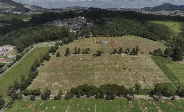 The sun shines over the Dom Bosco cemetery, where victims of Brazil's military dictatorship (1964-1985) were buried clandestinely, during a government ceremony to apologize to families, in Sao Paulo, Monday, March 24, 2025. (AP Photo/Andre Penner)