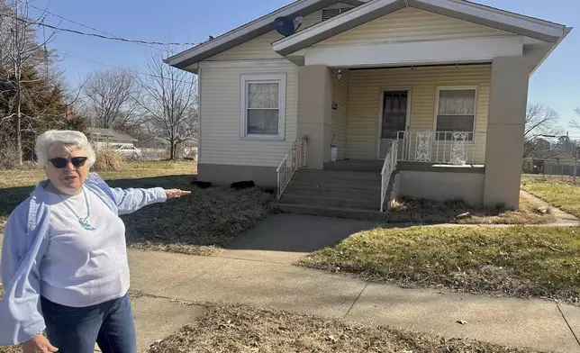 Sylvia Carvell describes her mother's childhood home in Murphysboro that was rebuilt to match the one destroyed in the March 18, 1925 Tri-State Tornado on March 11, 2025 in Murphysboro, Ill. (AP Photo/John O'Connor)
