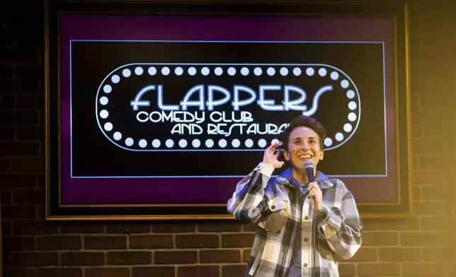 Kaycee Conlee performs during Stand Up For Climate, a comedy show at Flappers Comedy on Thursday, March 20, 2025, in Burbank, Calif. (AP Photo/Ethan Swope)
