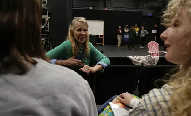 Professor Beth Osnes-Stoedefalke speaks with students during a creative climate communication class Thursday, March 20, 2025, in Boulder, Colo. (AP Photo/Brittany Peterson)