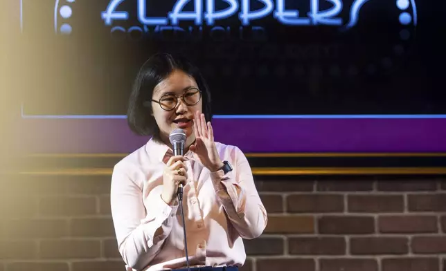 Corinna Yee performs during Stand Up For Climate, a comedy show at Flappers Comedy on Thursday, March 20, 2025, in Burbank, Calif. (AP Photo/Ethan Swope)